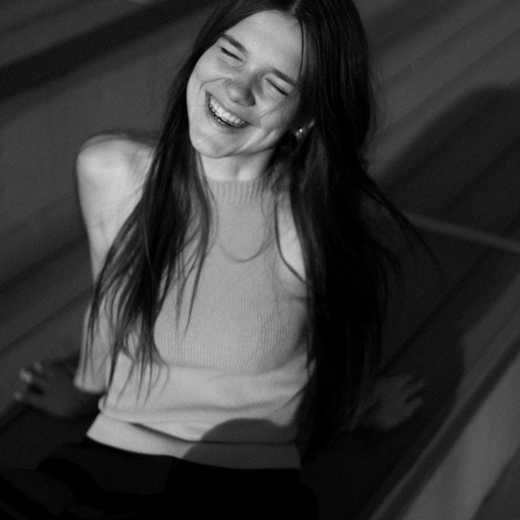 Kaveri Mehta, Lead Design Curator at NeatPortalFrame, reviewing corporate floral arrangements